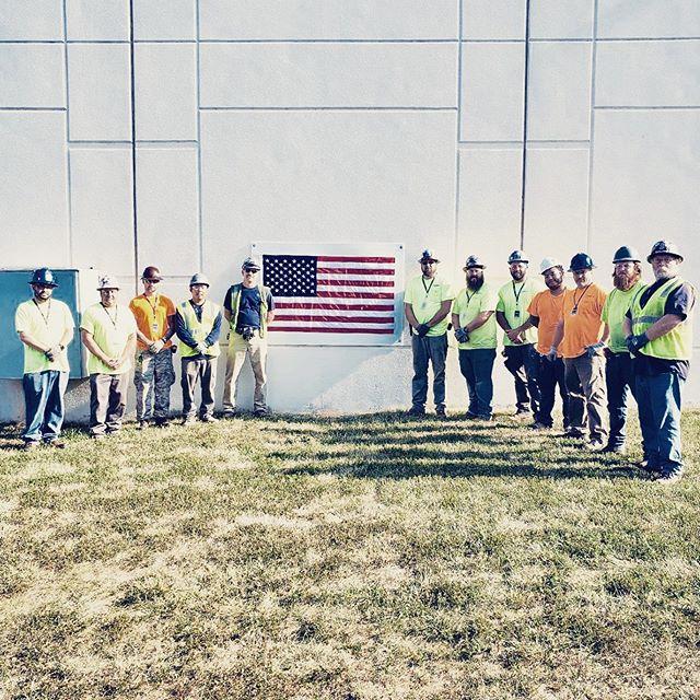 Group of workers with American Flag